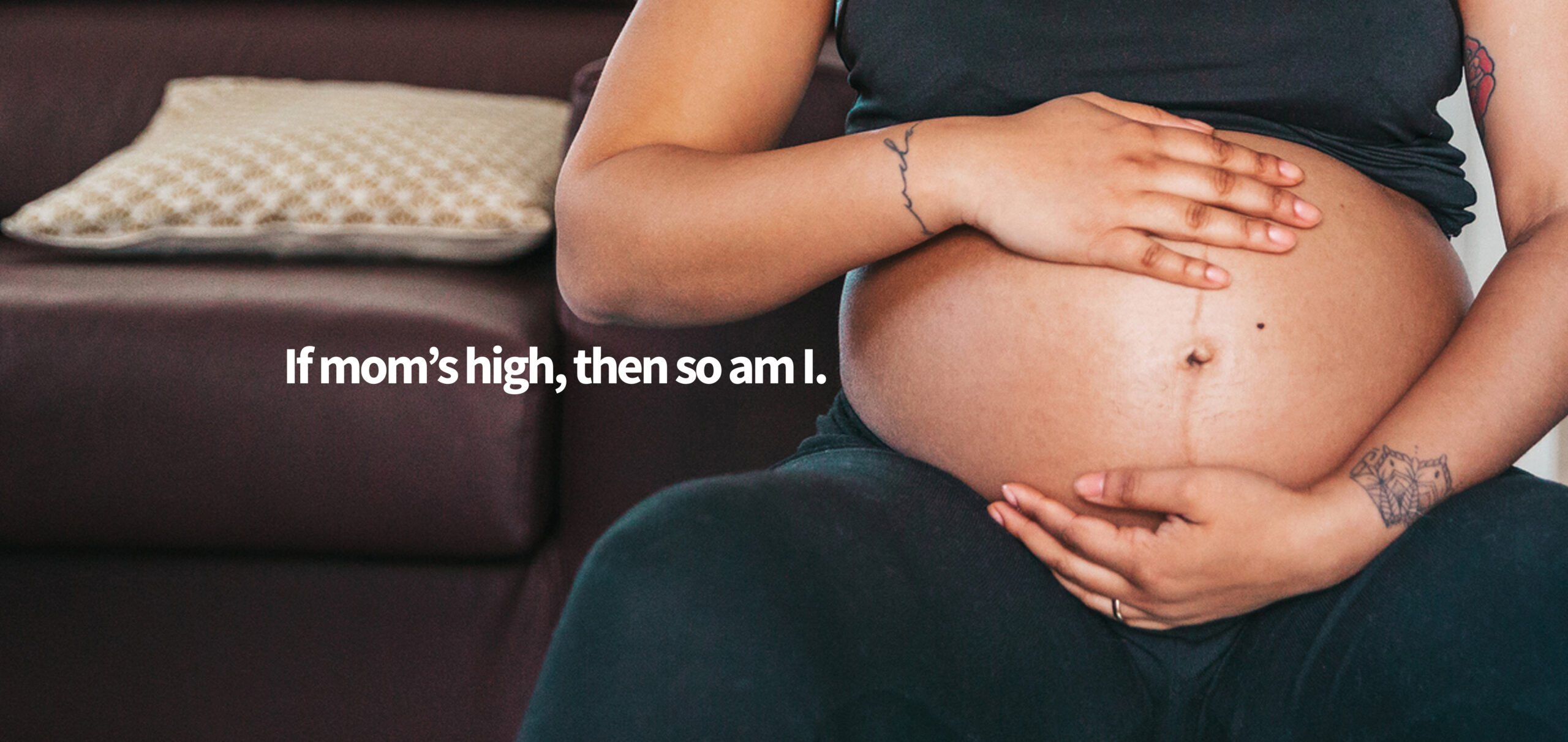 Mother with baby on her lap in the backyard